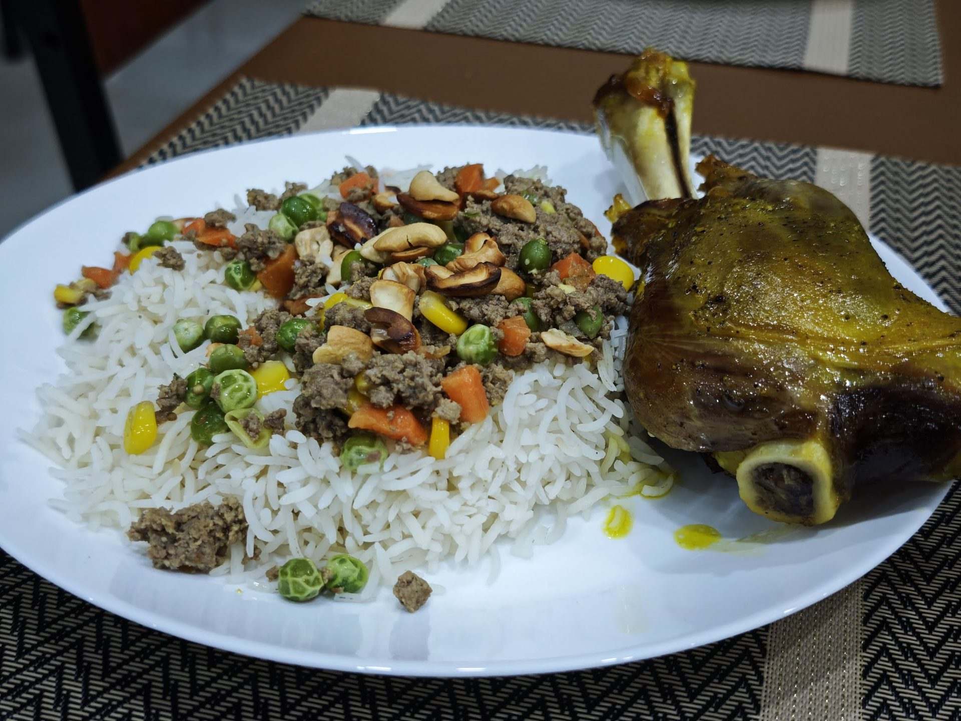 A platter of Palestinian ozi lamb shank with rice, minced meat and nuts